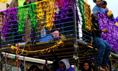 Mardi Gras celebrators overlook the parade Photo Credit: David Day