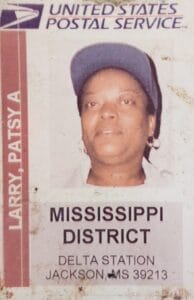 Patsy Larry's ID with the Post Office.