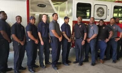 Firefighters with their new truck. Photo by David Day