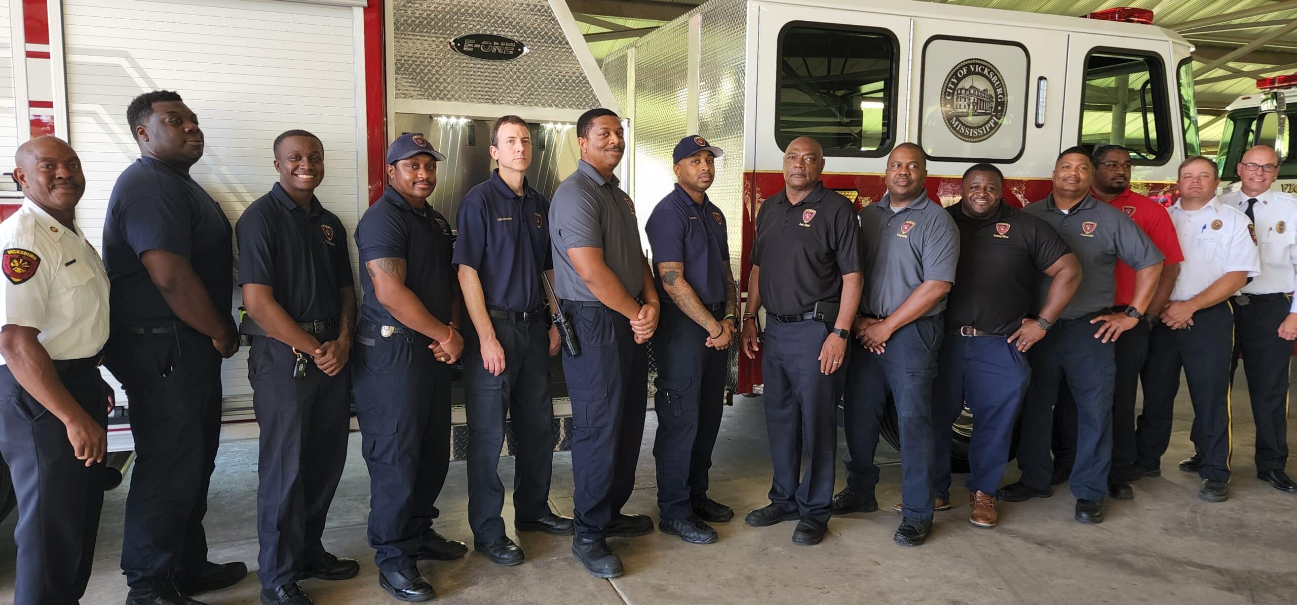 Firefighters with their new truck. Photo by David Day