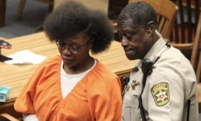 Jennifer Linear being escorted out of court