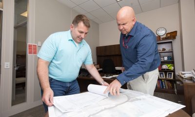 Jack Wheeldon, ERDC’s chief of Installation Support Division, and Michael Harding, ERDC master planner, review the plans with an estimated construction cost of $43 million.