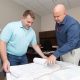 Jack Wheeldon, ERDC’s chief of Installation Support Division, and Michael Harding, ERDC master planner, review the plans with an estimated construction cost of $43 million.