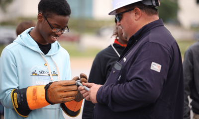 Photos are Walter Beesley, Entergy Mississippi lineman, shows student gloves. Grand Gulf training instructor Quinten Pullen shows students the control room simulator. Source: Entergy Nuclear Grand Gulf