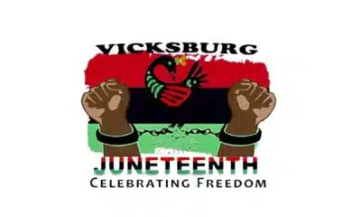 Vicksburg Juneteenth Heritage Festival logo featuring raised fists and a colorful background with the theme 'Celebrating F…