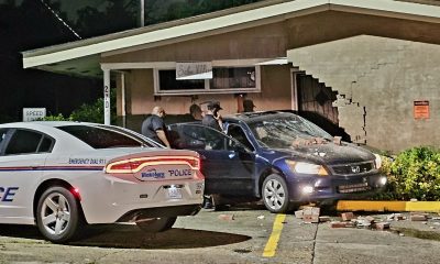 car crashes into building