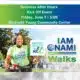 A woman in a green shirt promoting NAMI Vicksburg Walk for Mental Health at a community event.