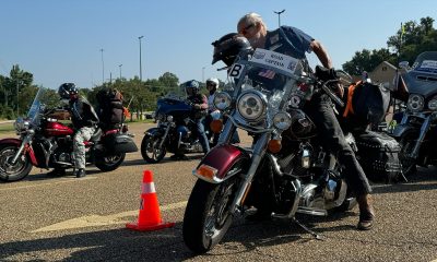 American Legion Riders Road Captain dismounts Photo by Don Hill