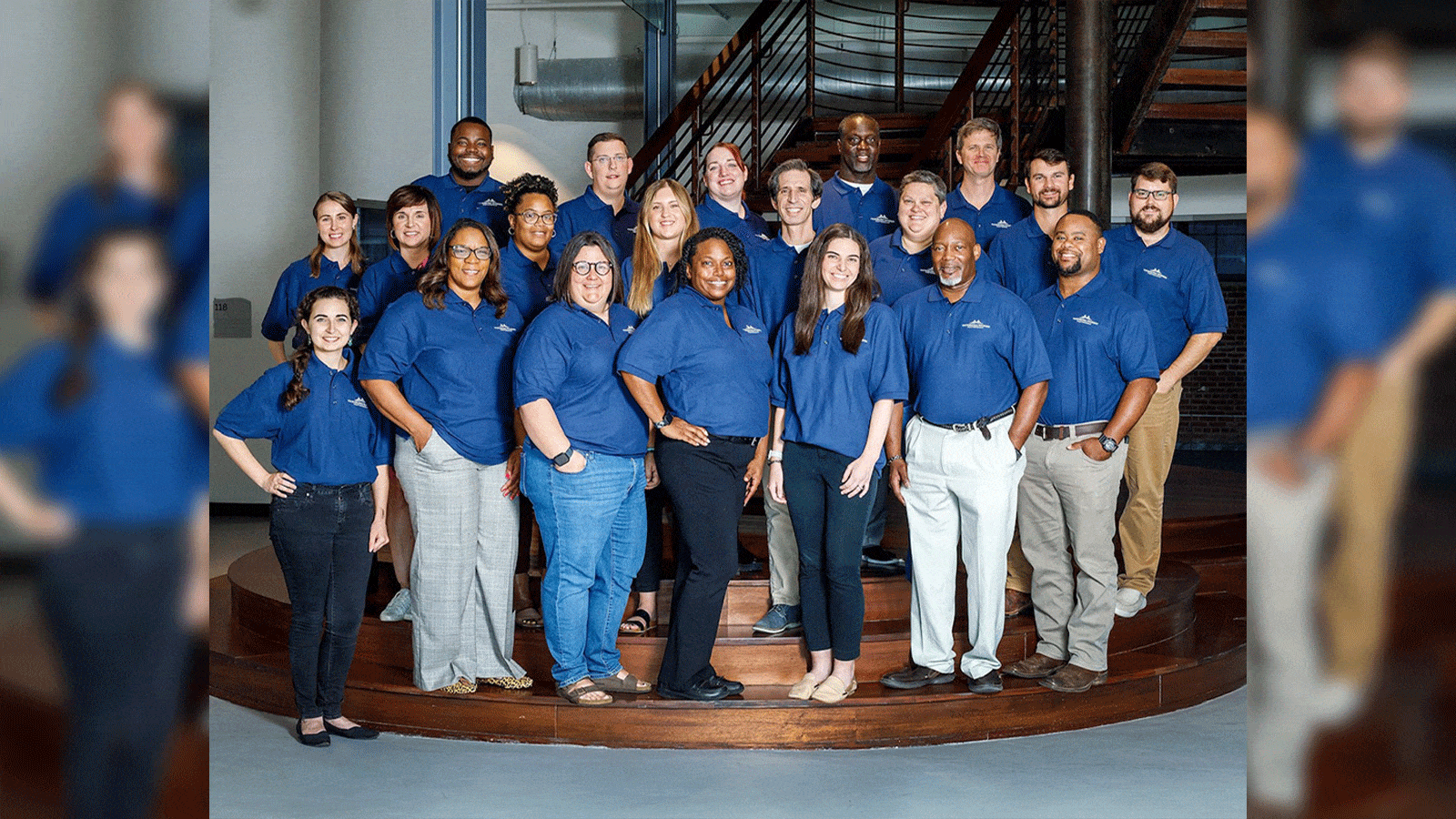 group picture of individuals on a staircase