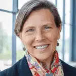 Dr. Kelle Barfield smiling, wearing a colorful scarf, with a bright background, repr — mississippi main street association
