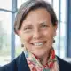 Dr. Kelle Barfield smiling, wearing a colorful scarf, with a bright background, repr — mississippi main street association