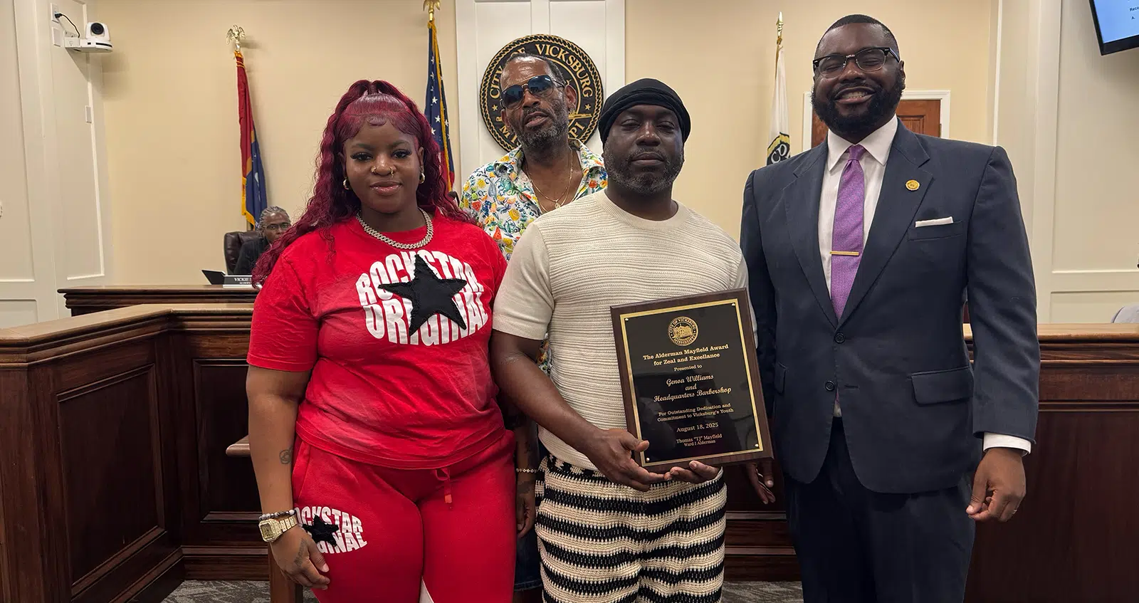Headquarters barbershop Amaze award recipient with TJ Mayfield Photo Don Hill