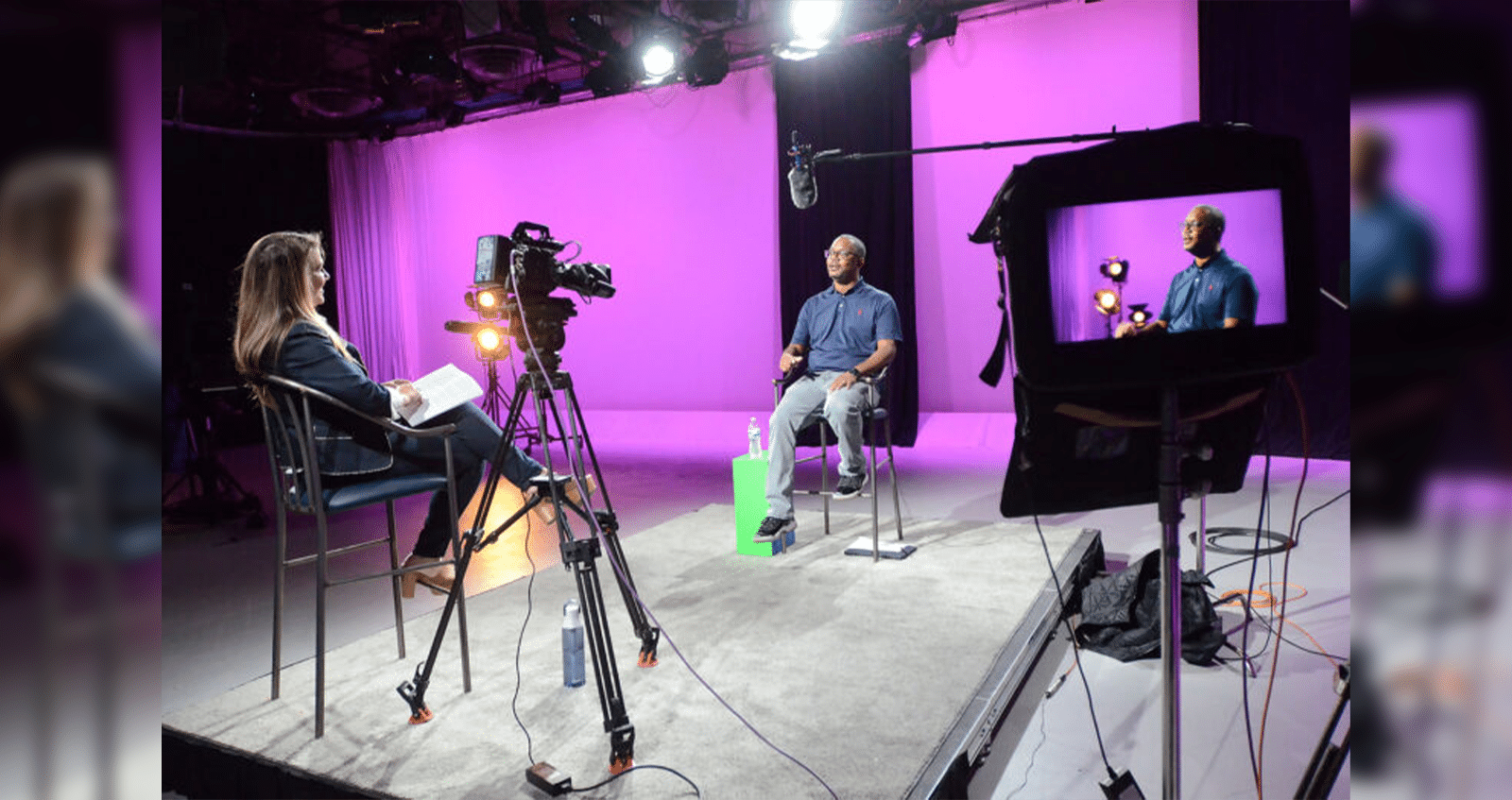 Mississippi Public Broadcasting Chief Operating Officer Anna Neel, left, and Chief Content Officer Taiwo Gaynor chat on set about Gaynor's Medgar Evers documentary at MPB headquarters, Friday, Aug. 1, 2025, in Jackson. Credit: Vickie D. King/Mississippi Today