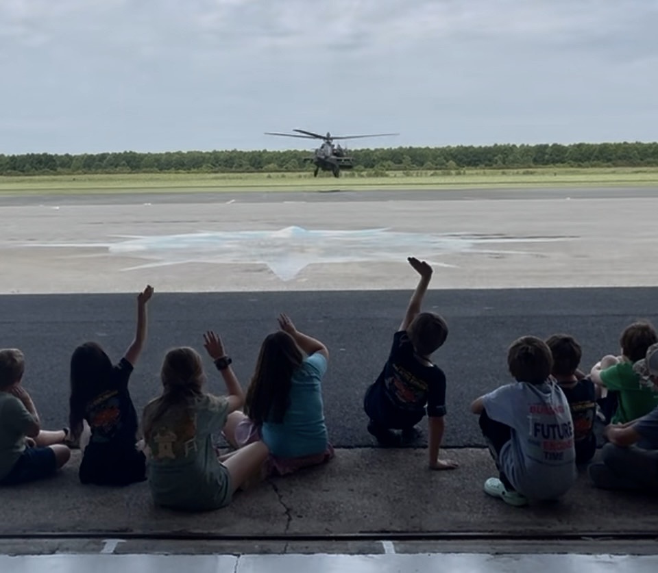 Campers get a front seat to landing helicopter.