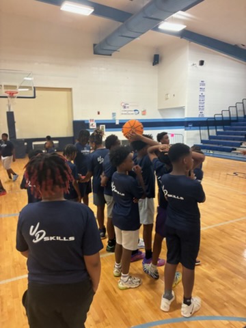 Taylor Barnes teaches at a basketball camp for Port Gibson youth.