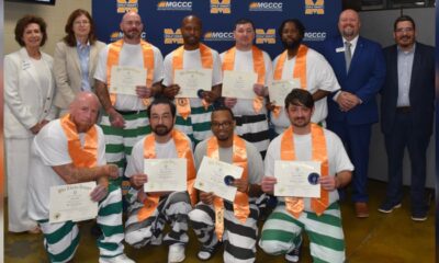 On far left, Dr. Mary S. Graham, MGCCC president, and Dr. Lynn Tincher-Ladner, president and CEO of Phi Theta Kappa Honor Society, stand with the eight students who are inaugural members of the Beta Tau Eta Chapter of Phi Theta Kappa at the George County Regional Correctional Facility. At far right is Dr. Brad Bailey, vice president of the Perkinston Campus and George County Center, and Will Overstreet, academic dean of the George County Center. Inductees are Arthur Ball, James Combs, Anthony Duchesne, Michael Gray, Timothy Jones, Grady Jones, Charles Kelton, and Royce Myers.