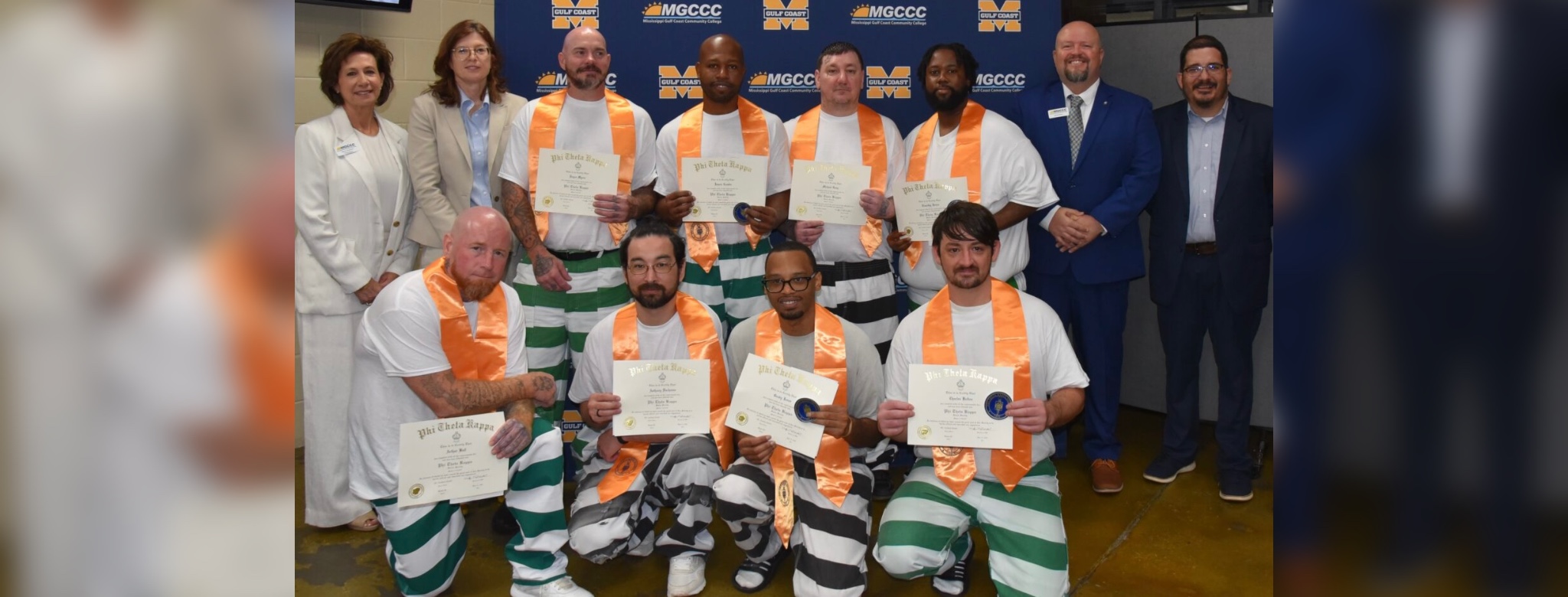 On far left, Dr. Mary S. Graham, MGCCC president, and Dr. Lynn Tincher-Ladner, president and CEO of Phi Theta Kappa Honor Society, stand with the eight students who are inaugural members of the Beta Tau Eta Chapter of Phi Theta Kappa at the George County Regional Correctional Facility. At far right is Dr. Brad Bailey, vice president of the Perkinston Campus and George County Center, and Will Overstreet, academic dean of the George County Center. Inductees are Arthur Ball, James Combs, Anthony Duchesne, Michael Gray, Timothy Jones, Grady Jones, Charles Kelton, and Royce Myers.