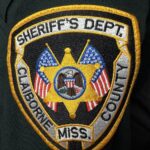 Embroidered patch of the Claiborne County Sheriff's Department featuring a star and American flags.