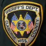 Embroidered patch of the Claiborne County Sheriff's Department featuring a star and American flags.
