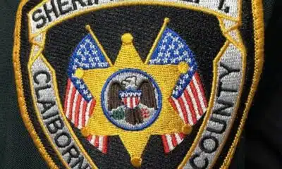 Embroidered patch of the Claiborne County Sheriff's Department featuring a star and American flags.