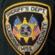 Embroidered patch of the Claiborne County Sheriff's Department featuring a star and American flags.