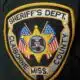 Embroidered patch of the Claiborne County Sheriff's Department featuring a star and American flags.