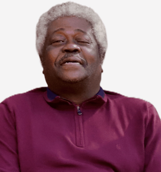 Smiling older man with gray hair wearing a maroon sweater, exuding warmth and contentment. — Roosevelt “Sonny” Jones Jr