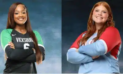 Two female volleyball players, one in a green jersey and the other in a red and blue jersey, posing — Volleyball Thursday