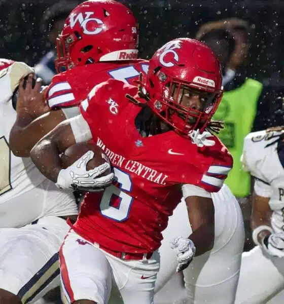 Warren Central player evades defenders during a rainy football g — Warren Central rolls past Pearl 40-14 to improve to 2-0