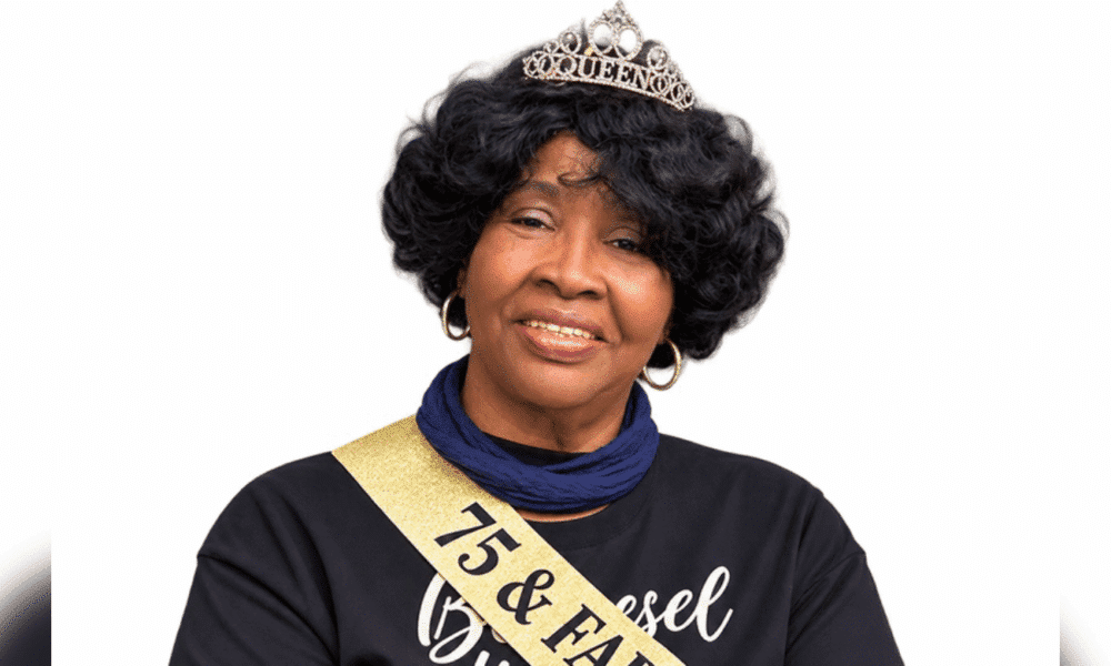 A woman wearing a tiara and sash celebrating her 75th birthday, smiling warmly. — Roberta Anderson