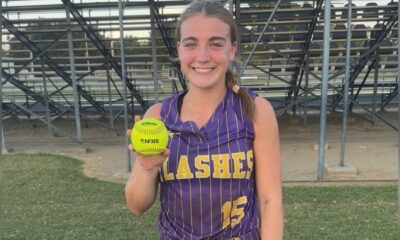 A young female softball player in a purple jersey — Theriot’s three-run homer lifts St. Aloysius past Washington School