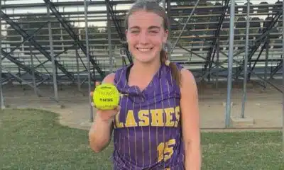 A young female softball player in a purple jersey — Theriot’s three-run homer lifts St. Aloysius past Washington School