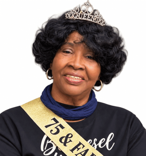 A woman wearing a tiara and sash celebrating her 75th birthday, smiling warmly. — Roberta Anderson
