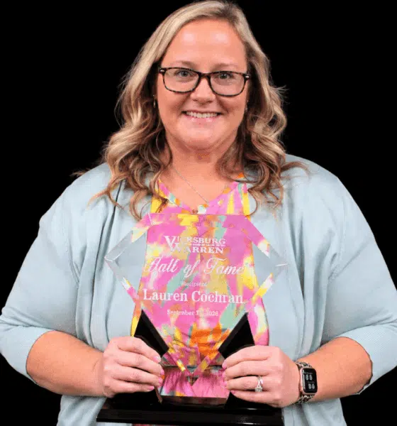Lauren Anderson Cochran proudly holds her award for induction into the VWSD Athletics Hall of Fame.