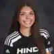 Jordan Polk, a soccer player in a Hinds Community College jersey, smiles for the camera.