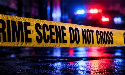 Police tape reading 'CRIME SCENE DO NOT CROSS' at a wet scene with emergency — Teenager shot in Vicksburg on Friday night