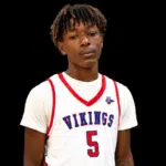 A young male athlete wearing a white basketball jersey with 'Vikings' and the number 5, standing against a — 16 identified