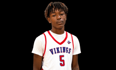 A young male athlete wearing a white basketball jersey with 'Vikings' and the number 5, standing against a — 16 identified