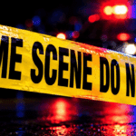 Police crime scene tape reading 'CRIME SCENE DO NOT CROSS' with blurr — Vicksburg man charged with capital murder in Texas