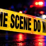 Police crime scene tape reading 'CRIME SCENE DO NOT CROSS' with blurr — Vicksburg man charged with capital murder in Texas