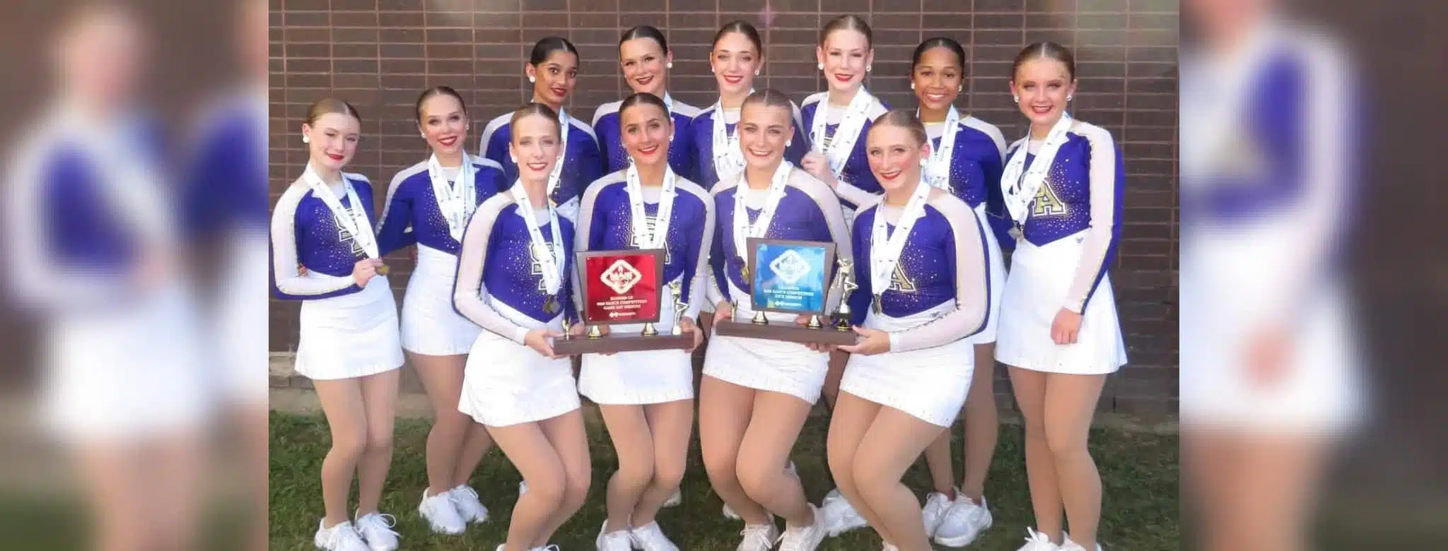 The Flashettes team poses with their trophies after winning the 12th consecutive state title at the MAIS — Flashettes 12th
