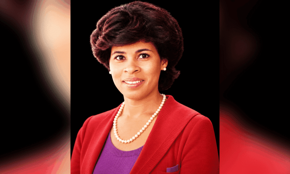 Portrait of Vicki Roach Barnes, a distinguished judge, wearing a red blazer and pearls.
