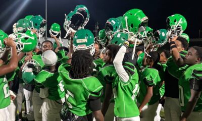 VJHS football team celebrating with helmets raised after a victory against Germantown. — VJHS crushed Germantown 38-16