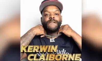 Kerwin Claiborne posing confidently while wearing a chain and a baseball cap, promoting his comedy show.