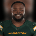 Nick Anderson smiling in Edmonton Elks uniform, showcasing his leadership in football.