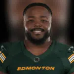 Nick Anderson smiling in Edmonton Elks uniform, showcasing his leadership in football.