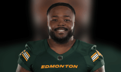 Nick Anderson smiling in Edmonton Elks uniform, showcasing his leadership in football.
