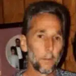 A man with a beard and short hair, looking directly at the camera, with a blurred backgr — Ronald “Ronnie” Lynn McLeod