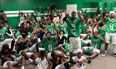 VJHS football team celebrating in locker room after their 4-0 victory, showing team spirit and exci — VJHS improves to 4-0