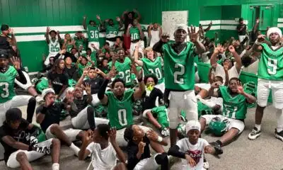VJHS football team celebrating in locker room after their 4-0 victory, showing team spirit and exci — VJHS improves to 4-0